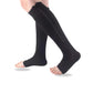 Women's compression socks in black and nude with a zipper running up the side of the calf