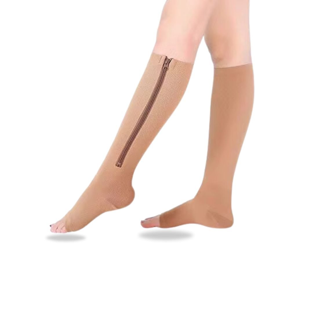 Women's compression socks in black and nude with a zipper running up the side of the calf