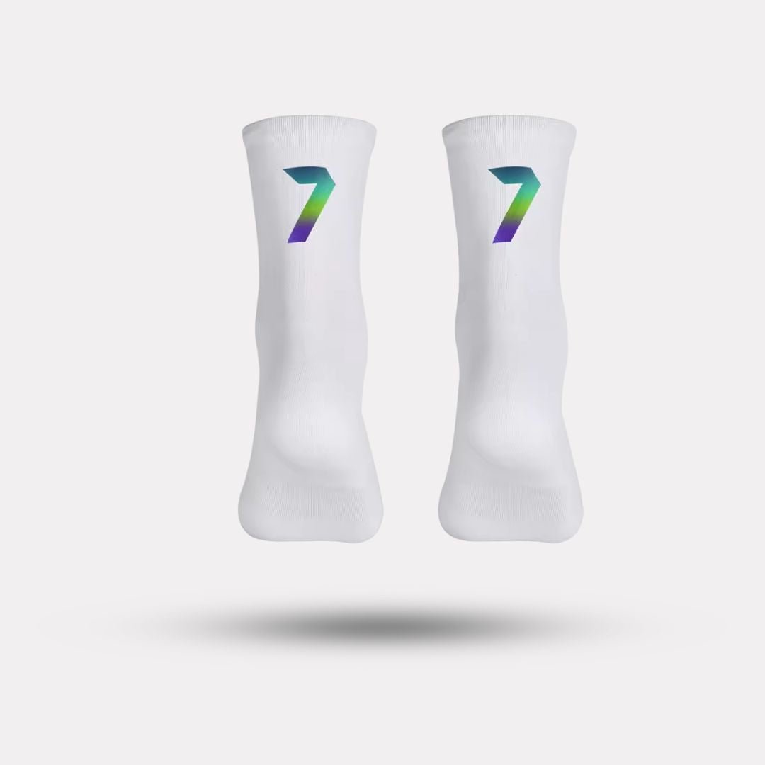 Black cycling socks with reflective stripes, worn high on the calf