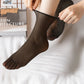 Black tourmaline self-heating socks with magnetic dots along the sole