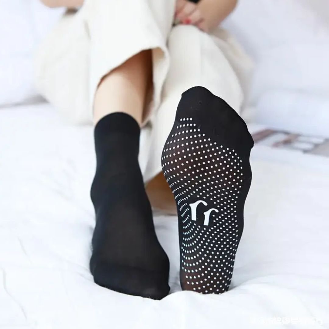 Black tourmaline self-heating socks with magnetic dots along the sole