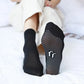 Knee-high massage socks with textured knit pressure zones along the calf