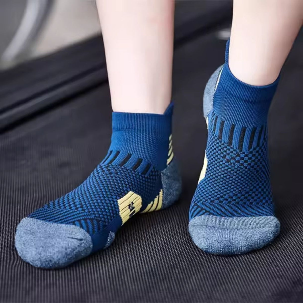 Three pairs of navy sport socks with reinforced heel and toe panels