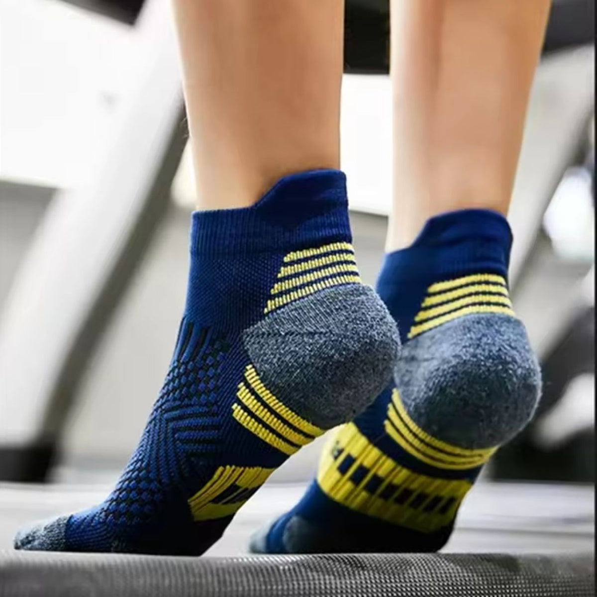 Three pairs of navy sport socks with reinforced heel and toe panels
