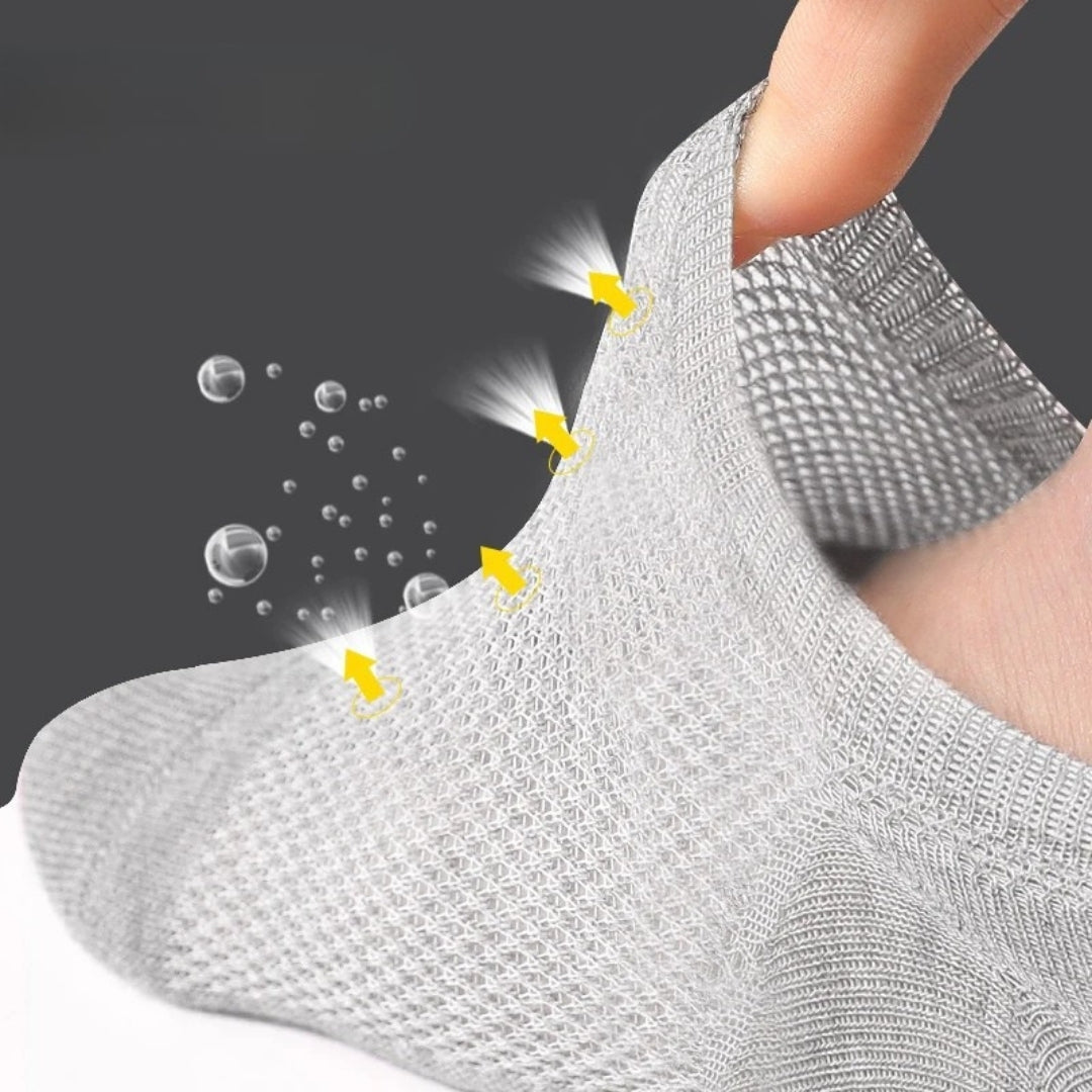 Pair of white bamboo fiber socks knitted to keep the foot dry