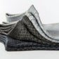 Five pairs of soft bamboo fiber socks in black and gray, worn up to mid-calf