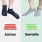 Five pairs of soft bamboo fiber socks in black and gray, worn up to mid-calf