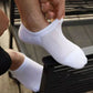 Thin bamboo fiber socks in black, white and mixed colors, sitting just above the ankle