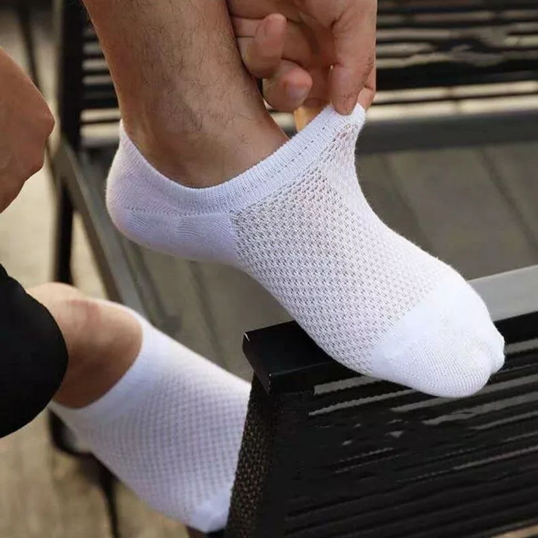 Thin bamboo fiber socks in black, white and mixed colors, sitting just above the ankle