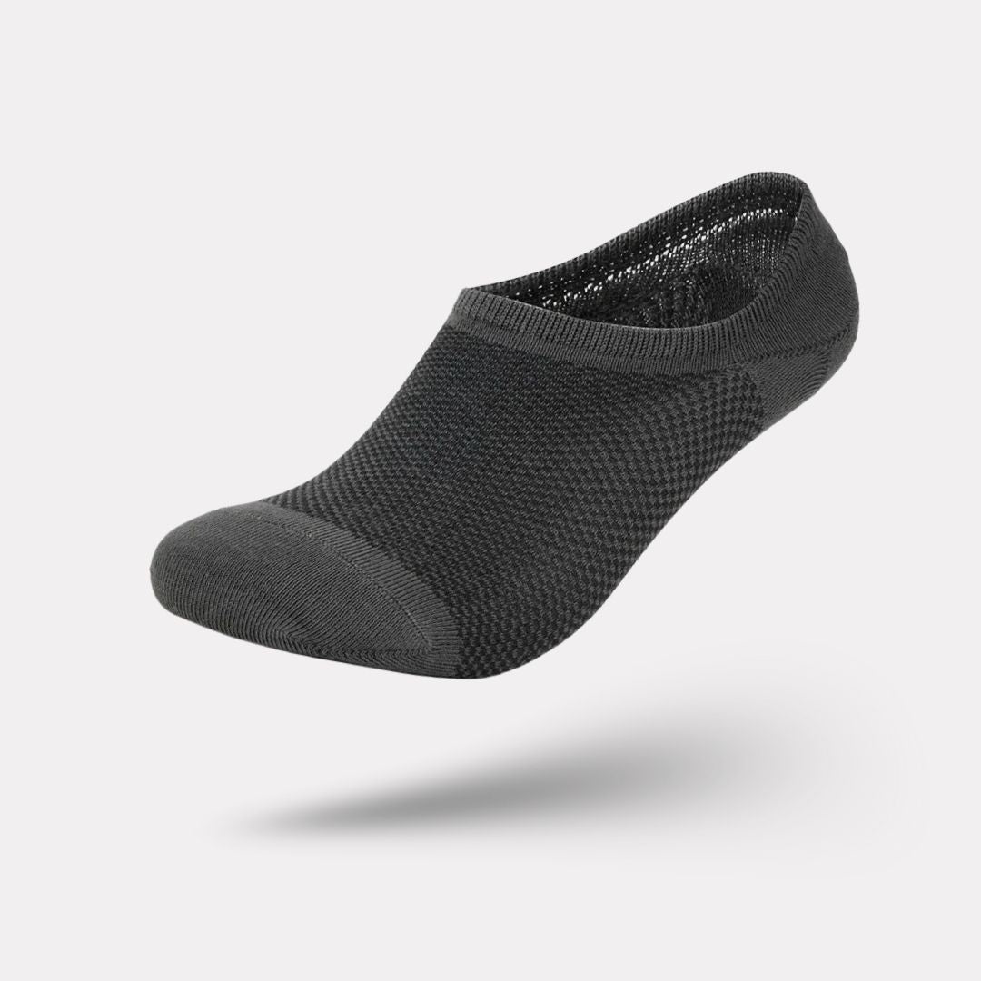 Thin bamboo fiber socks in black, white and mixed colors, sitting just above the ankle