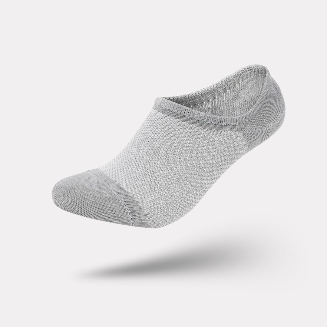Thin bamboo fiber socks in black, white and mixed colors, sitting just above the ankle