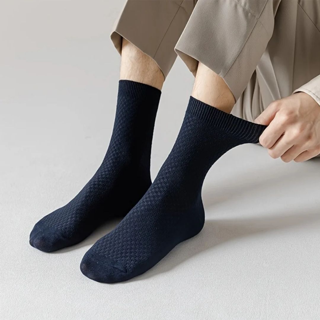 Bamboo fiber crew socks worn at the ankle, in five-pair packs of black, gray or navy