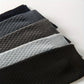 Bamboo fiber crew socks worn at the ankle, in five-pair packs of black, gray or navy
