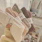 Soft wool socks for women in gray, purple, pink, black and white, sold in packs of three