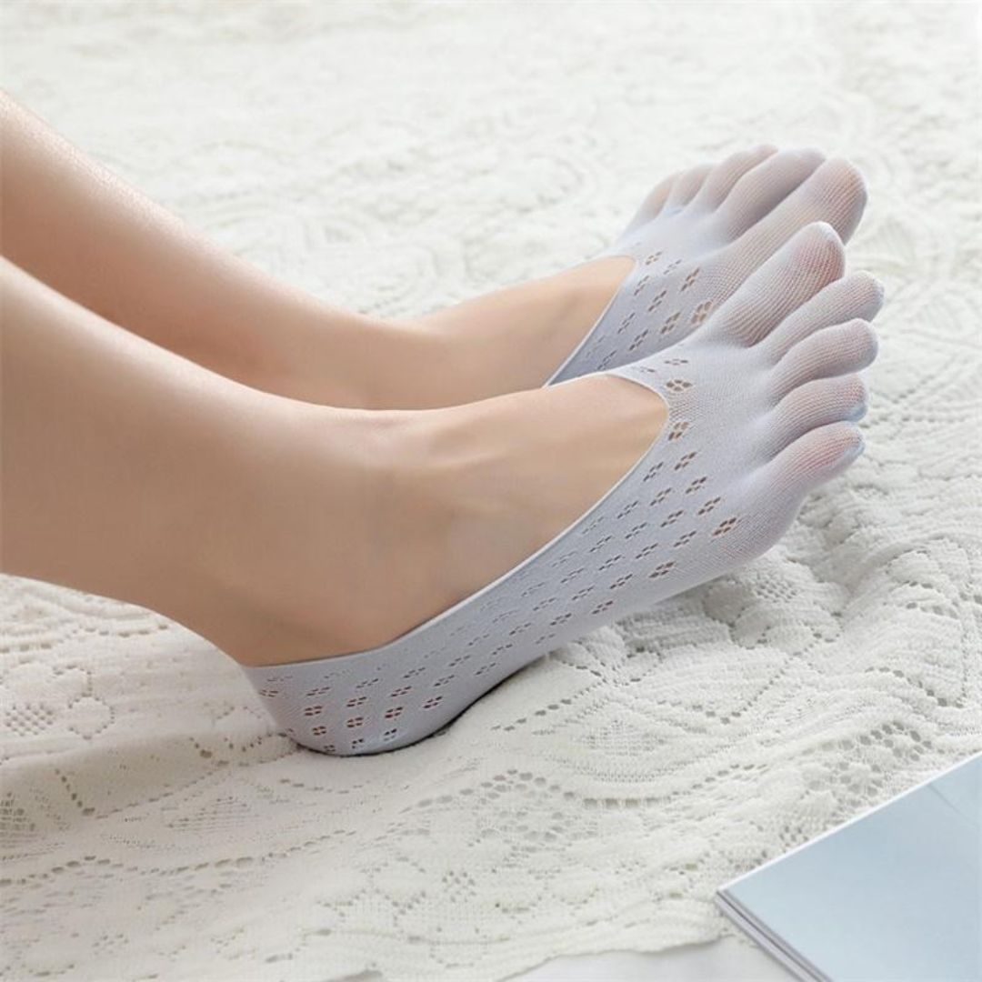 Orthopedic compression socks worn up the calf, in nude, white, gray and pink