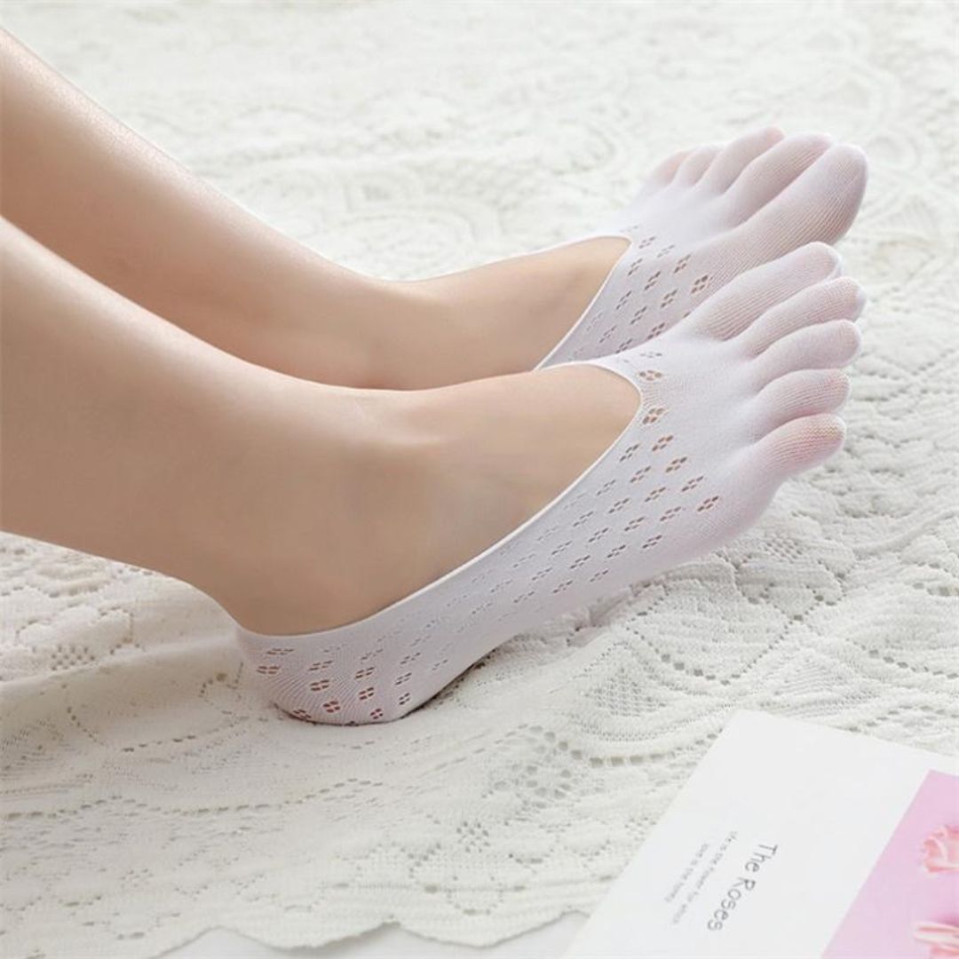 Orthopedic compression socks worn up the calf, in nude, white, gray and pink