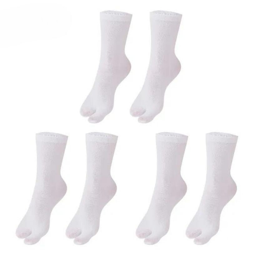 Gray, black and white socks shaped to fit around a bunion corrector on the big toe
