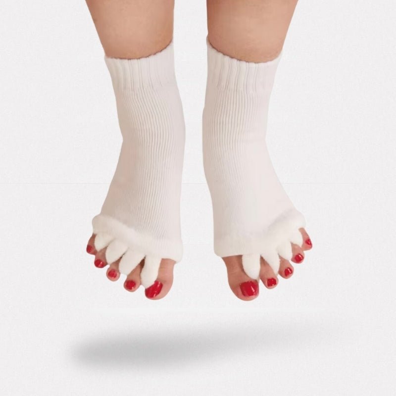 Toe separator socks in white or black that hold each toe apart while worn