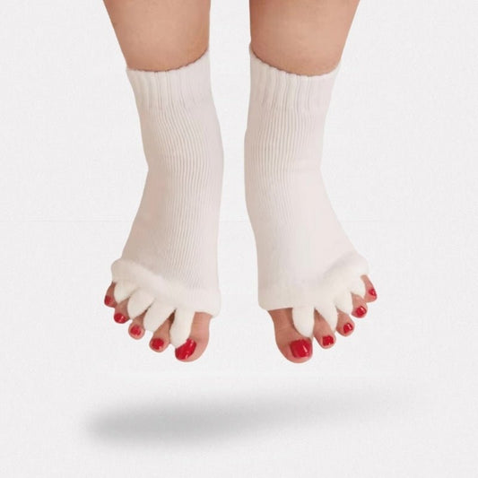 Toe separator socks in white or black that hold each toe apart while worn