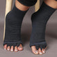 Toe separator socks in white or black that hold each toe apart while worn