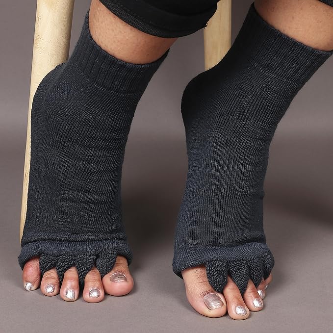 Toe separator socks in white or black that hold each toe apart while worn