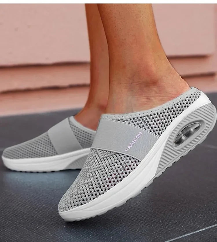 Orthopedic wedge slippers with a raised heel and open toe, in deep blue, gray, black and pink