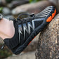Barefoot shoes with a wide toe box that lets the toes spread, in black, gray, red and blue