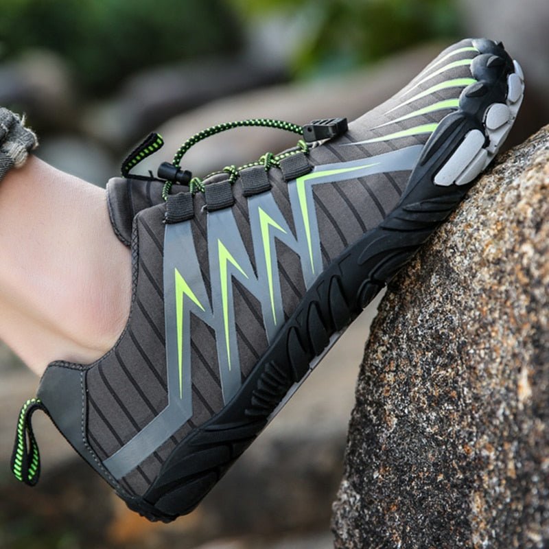 Barefoot shoes with a wide toe box that lets the toes spread, in black, gray, red and blue