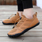 Barefoot hiking shoes with a thin flexible sole and wide toe box, in bronze, gray and black