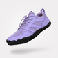 Gray barefoot hiking shoes with a grippy thin outsole and a wide toe box