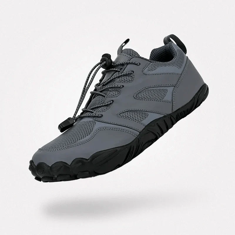 Gray barefoot hiking shoes with a grippy thin outsole and a wide toe box