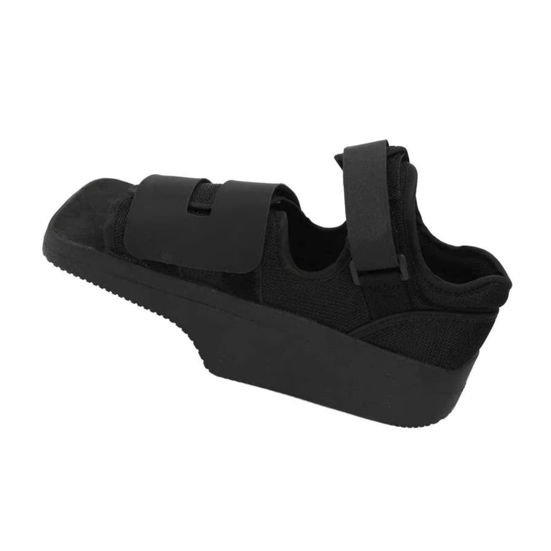 Post-op offloading shoe with adjustable straps and a rigid non-slip sole for a bandaged foot