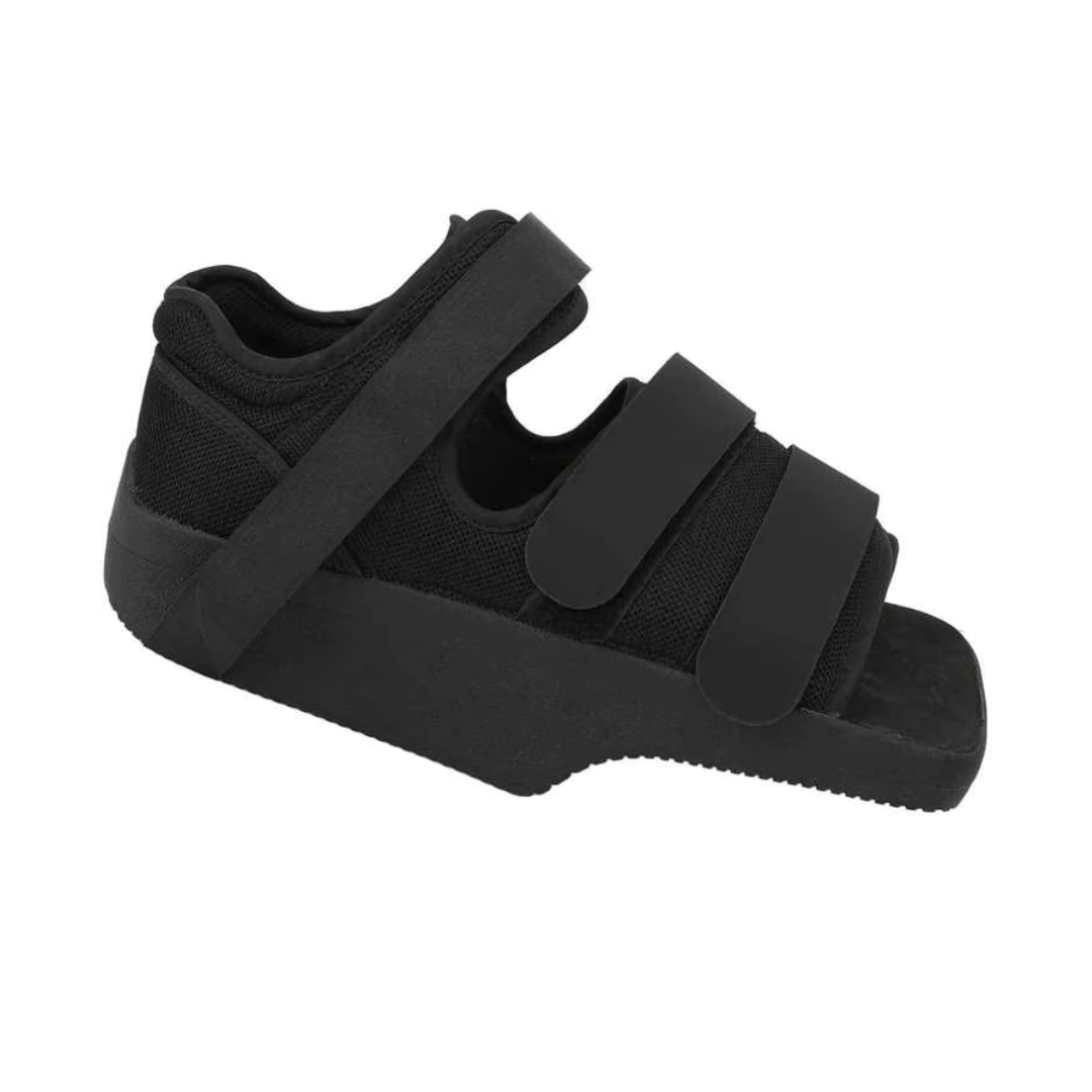 Post-op offloading shoe with adjustable straps and a rigid non-slip sole for a bandaged foot
