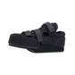 Post-op offloading shoe with adjustable straps and a rigid non-slip sole for a bandaged foot