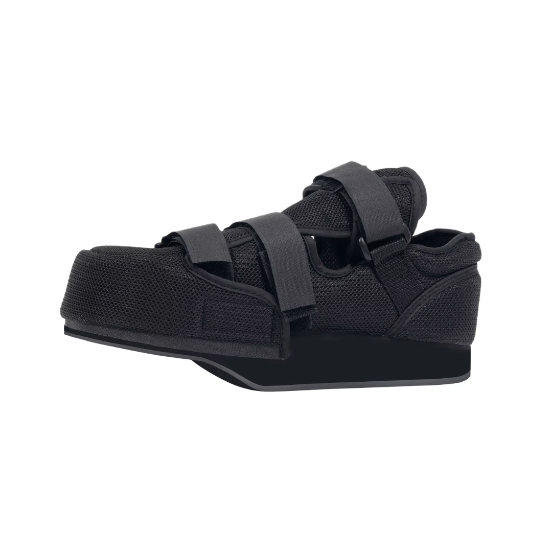 Post-op offloading shoe with adjustable straps and a rigid non-slip sole for a bandaged foot