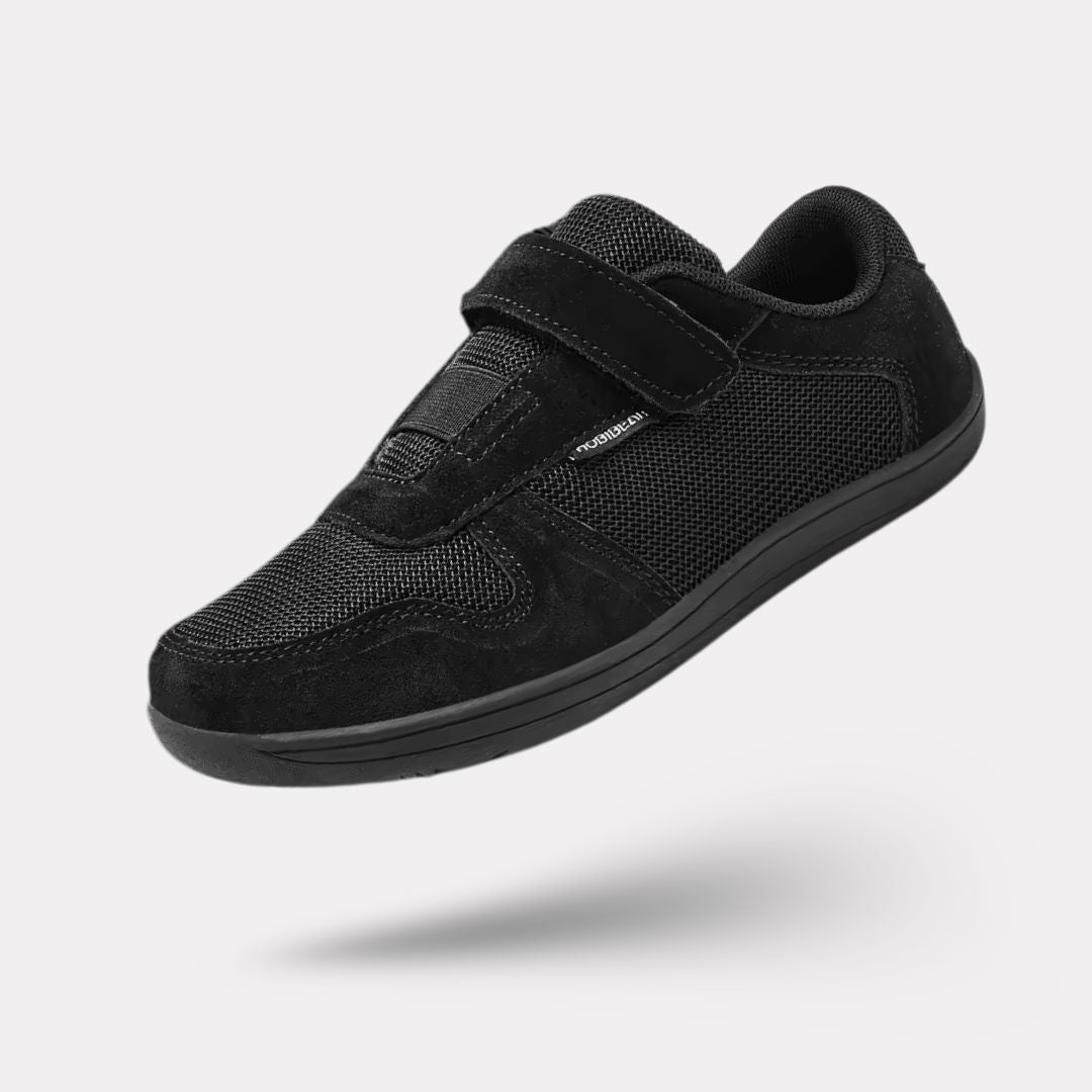 Blue barefoot shoes for kids with a thin flexible sole and a roomy toe box