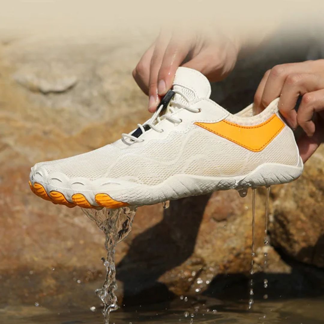 Light gray minimalist barefoot sneakers with a flat sole and a wide toe box