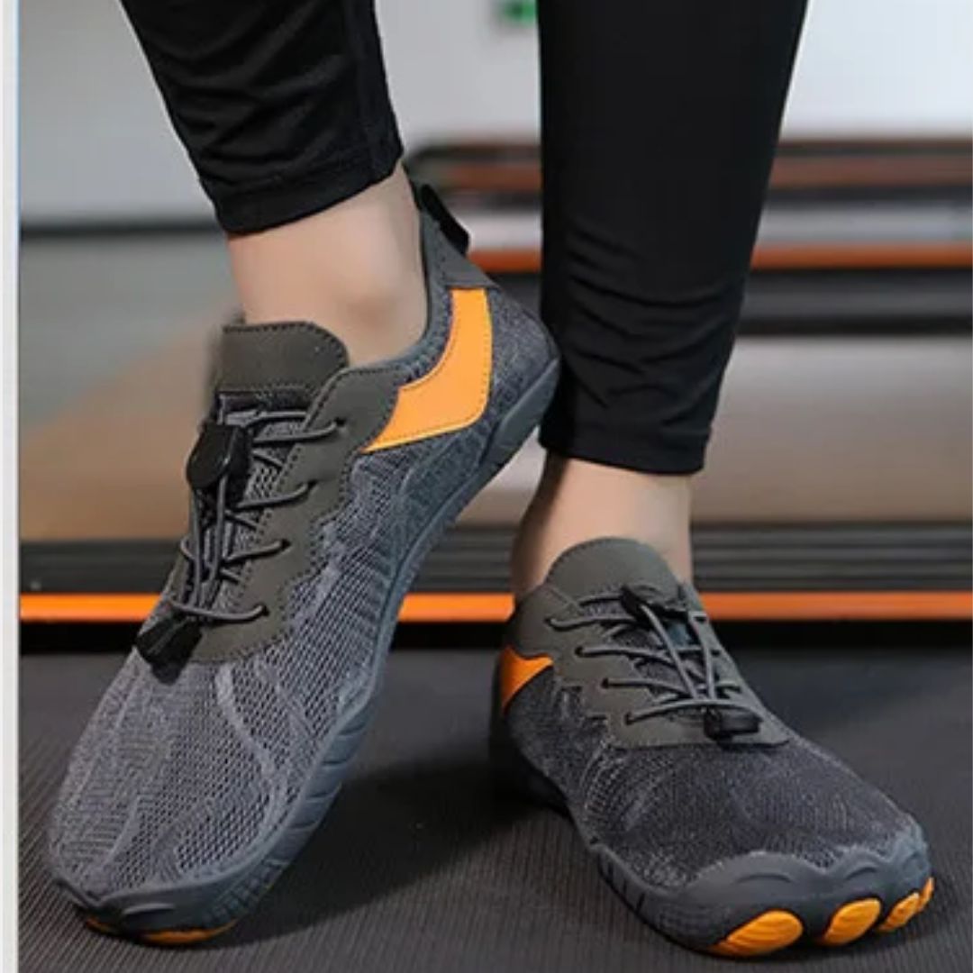 Light gray minimalist barefoot sneakers with a flat sole and a wide toe box