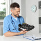 Blue orthopedic walking shoes with a knit upper and a shock absorbing sole