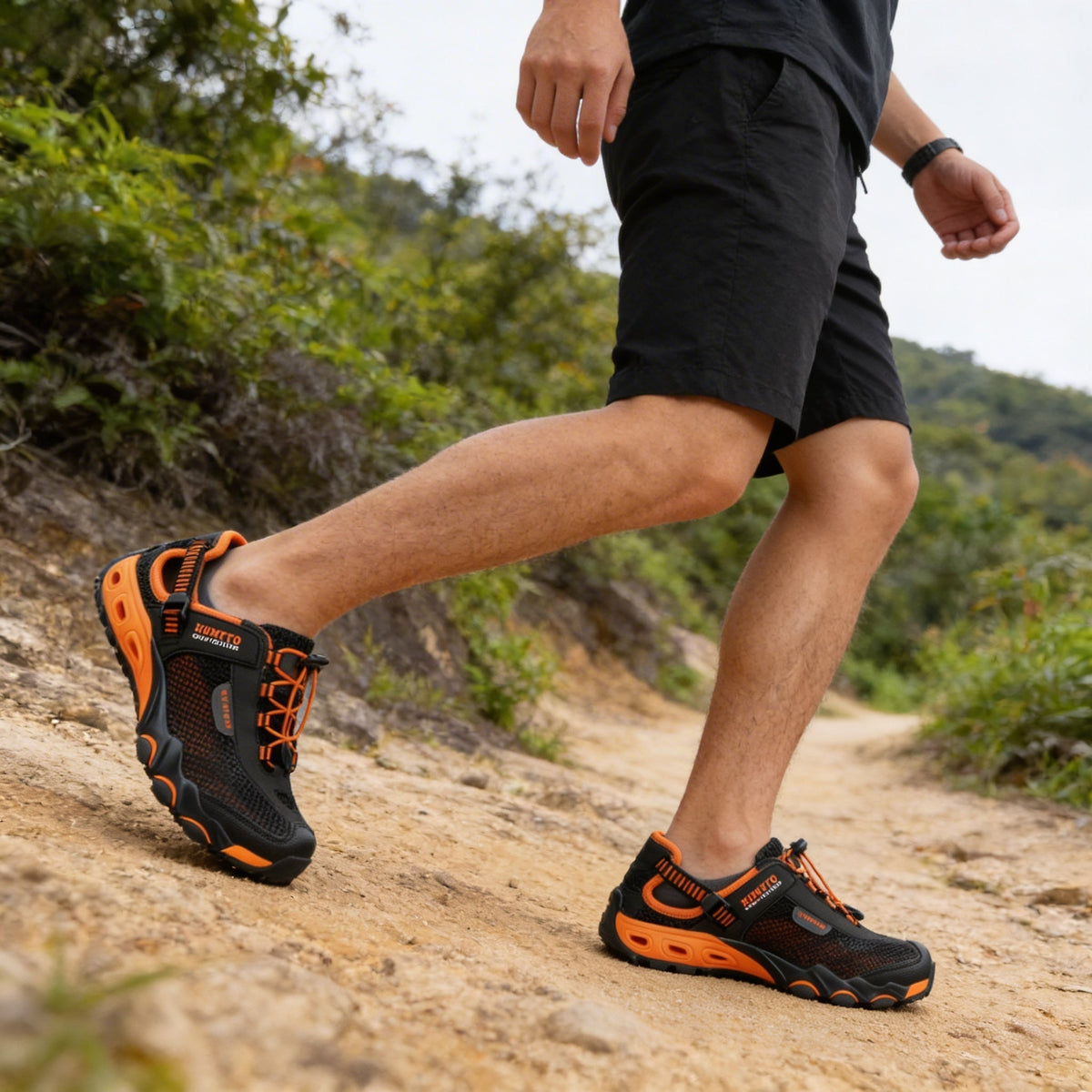 Water hiking shoes with a lugged rubber outsole and draining mesh upper, in black, gray or blue