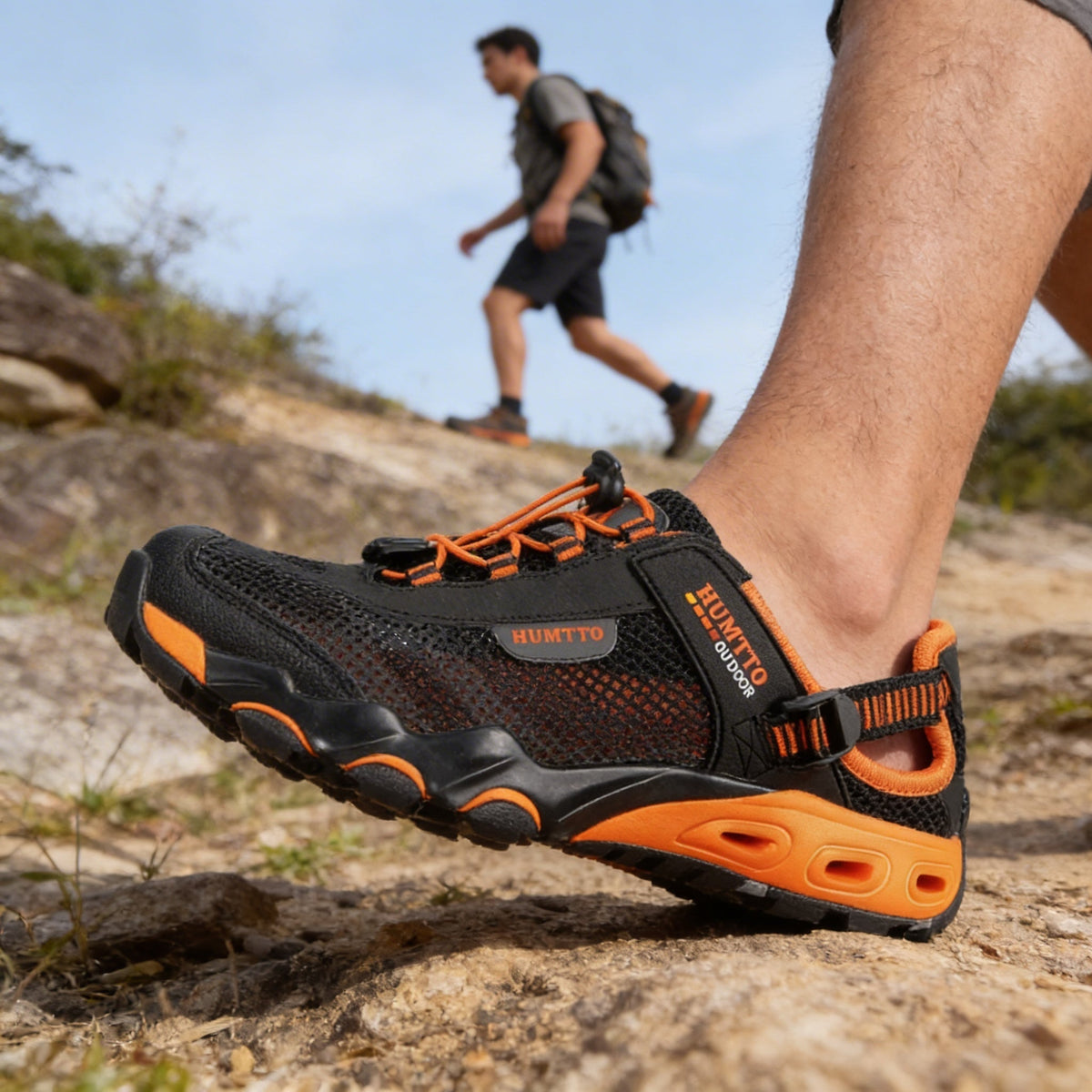 Water hiking shoes with a lugged rubber outsole and draining mesh upper, in black, gray or blue