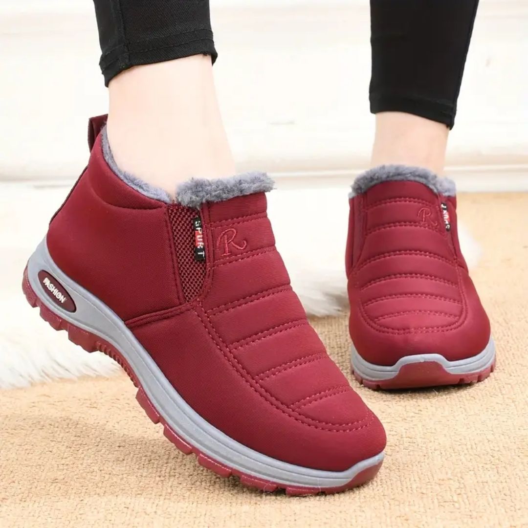 Red winter shoes for women with a warm lining and an easy slip-on fit