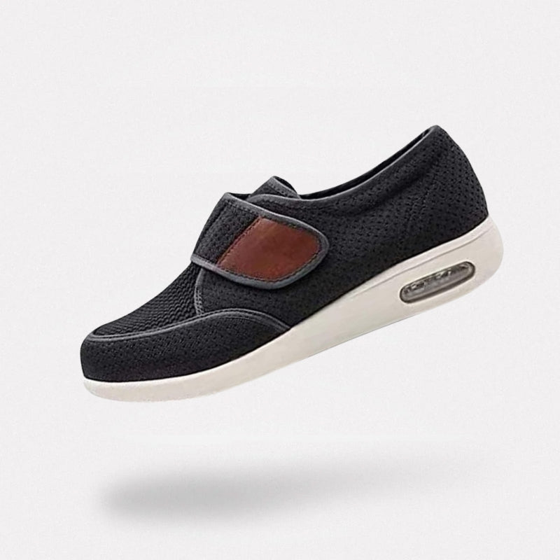 Black wide orthopedic shoes with hook-and-loop straps across the instep
