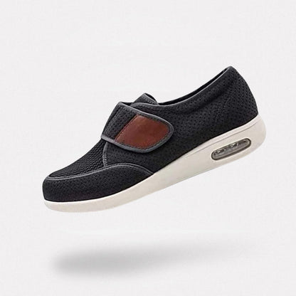 Black wide orthopedic shoes with hook-and-loop straps across the instep