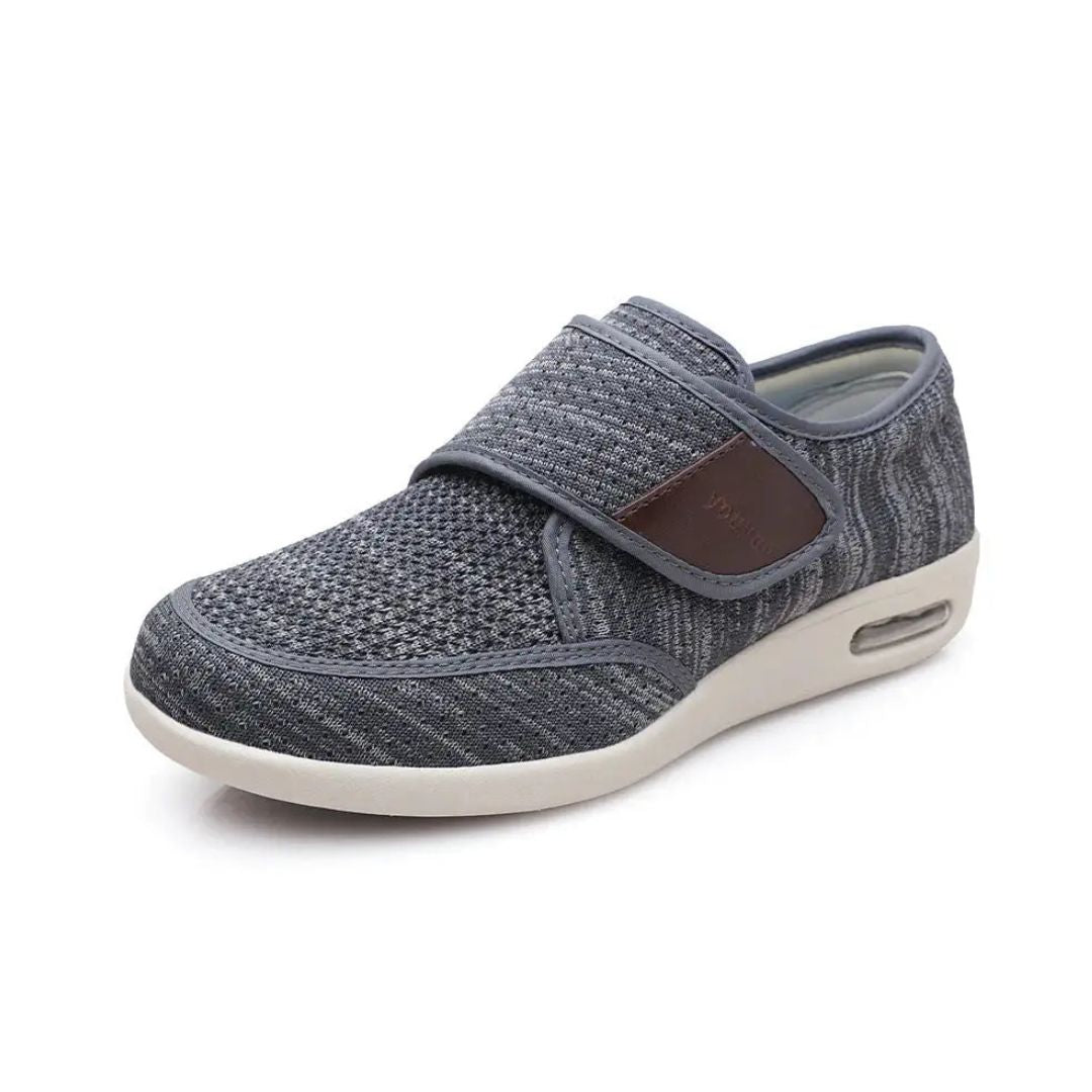 Black wide orthopedic shoes with hook-and-loop straps across the instep