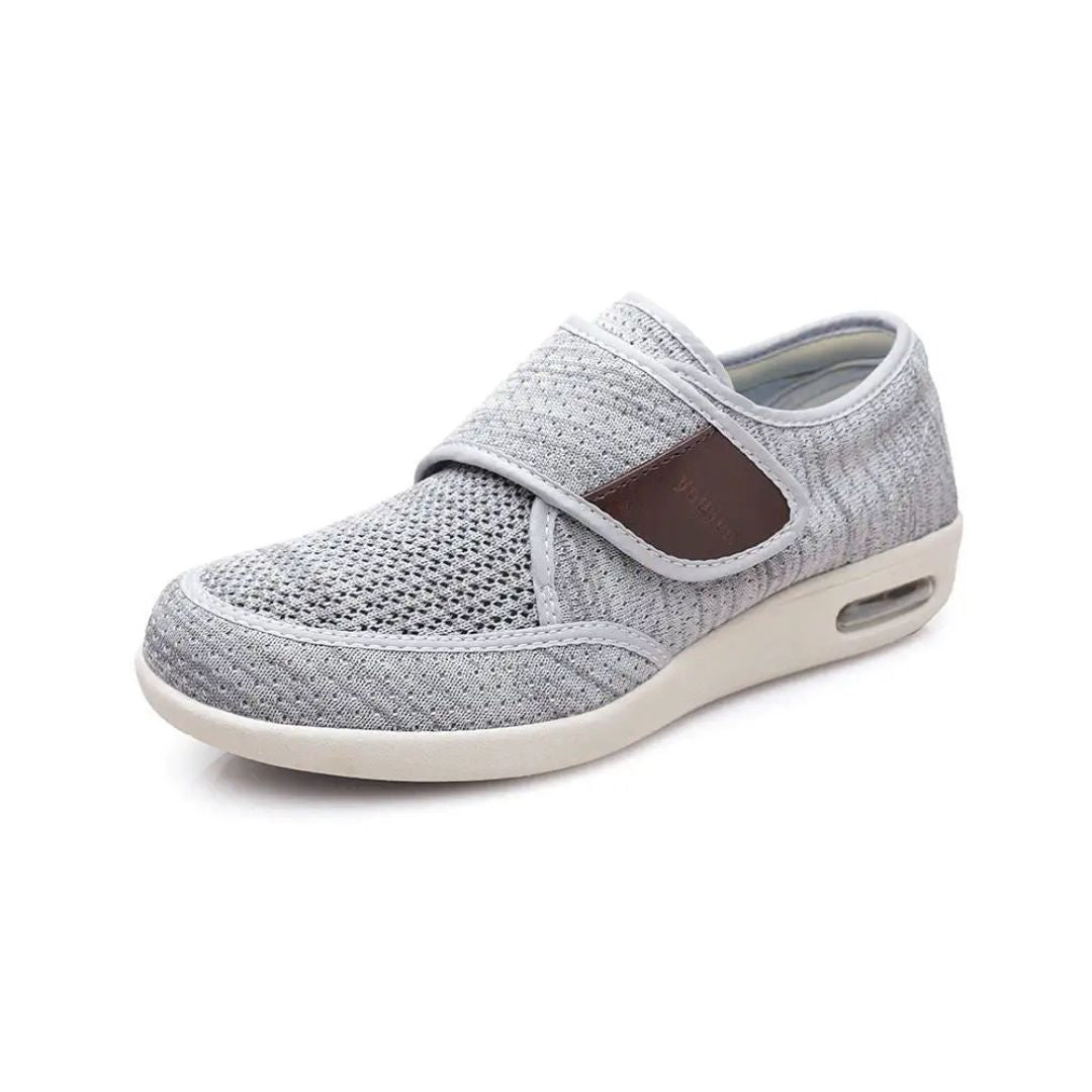 Black wide orthopedic shoes with hook-and-loop straps across the instep