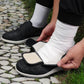 Black wide orthopedic shoes with hook-and-loop straps across the instep