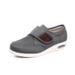 Black wide orthopedic shoes with hook-and-loop straps across the instep
