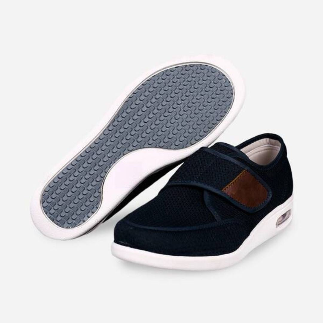 Black wide orthopedic shoes with hook-and-loop straps across the instep