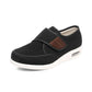 Black wide orthopedic shoes with hook-and-loop straps across the instep
